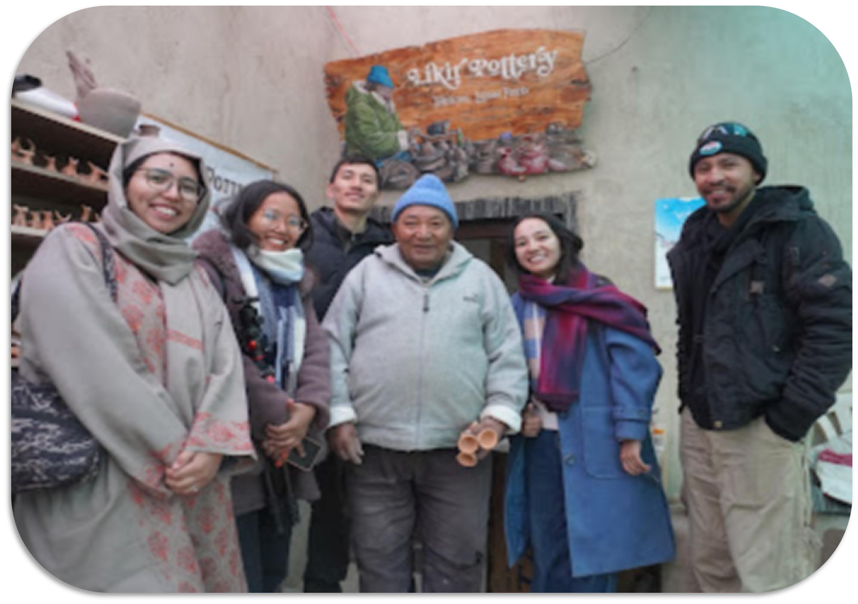 Group travellers with a local artisan